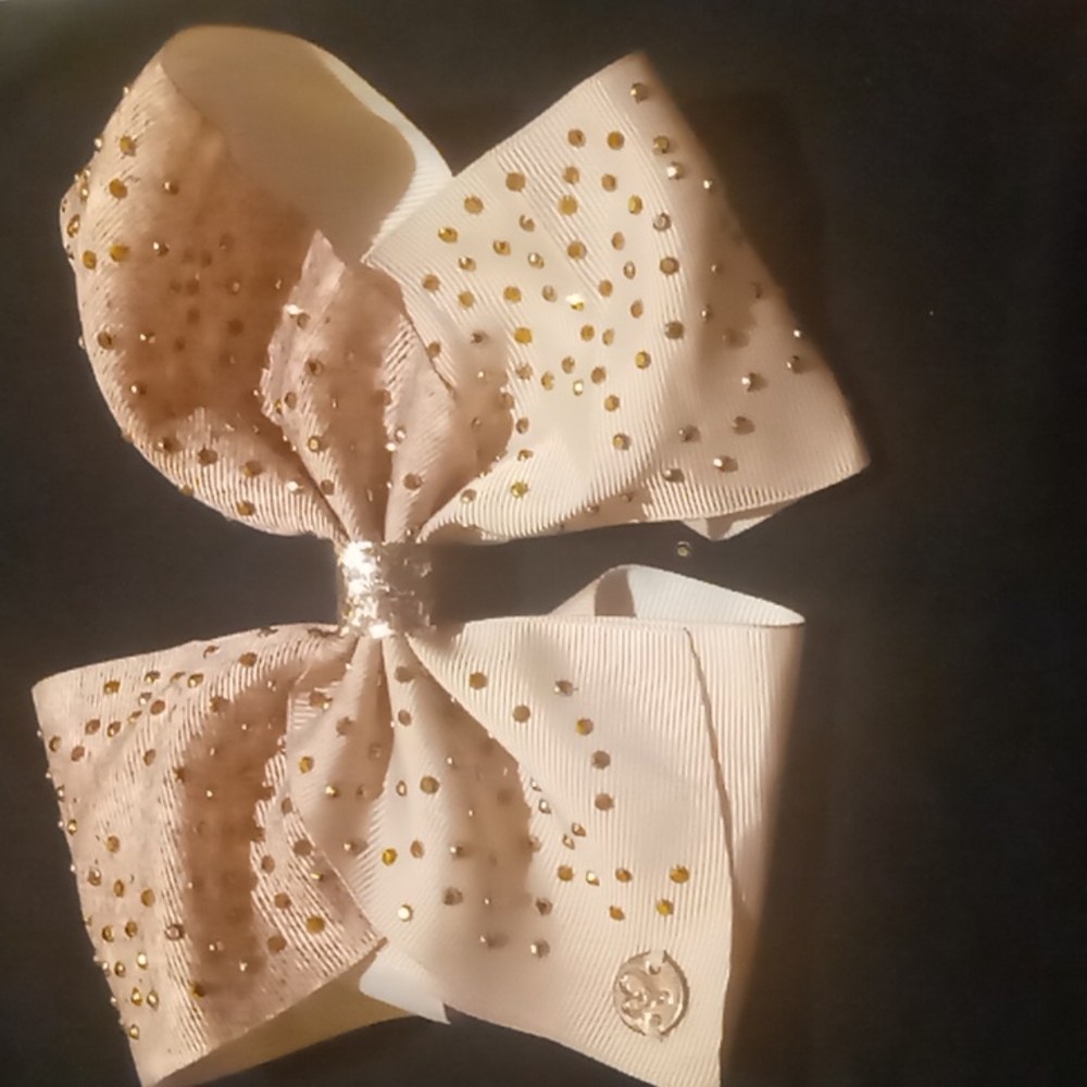 Pink Jojo siwa bow with golden sequins